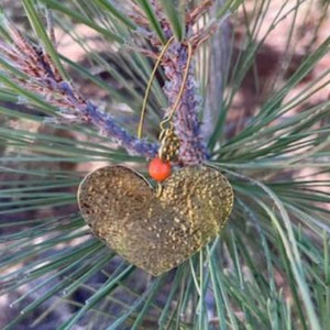 Handmade hammered heart ornament with petit ornament